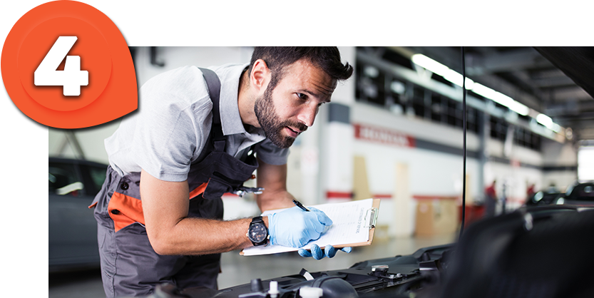 Casa Ford Technician examining a ford vehicle
